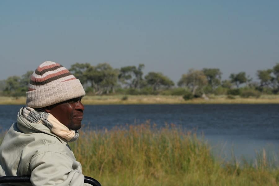 sitting by body of water