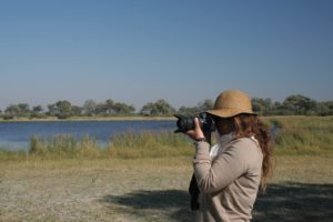 A woman with a camera - 10 items to take on safari