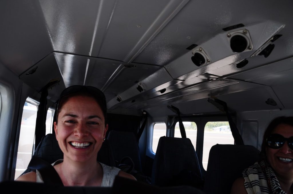 Jenny sitting in the cabin of a small plane