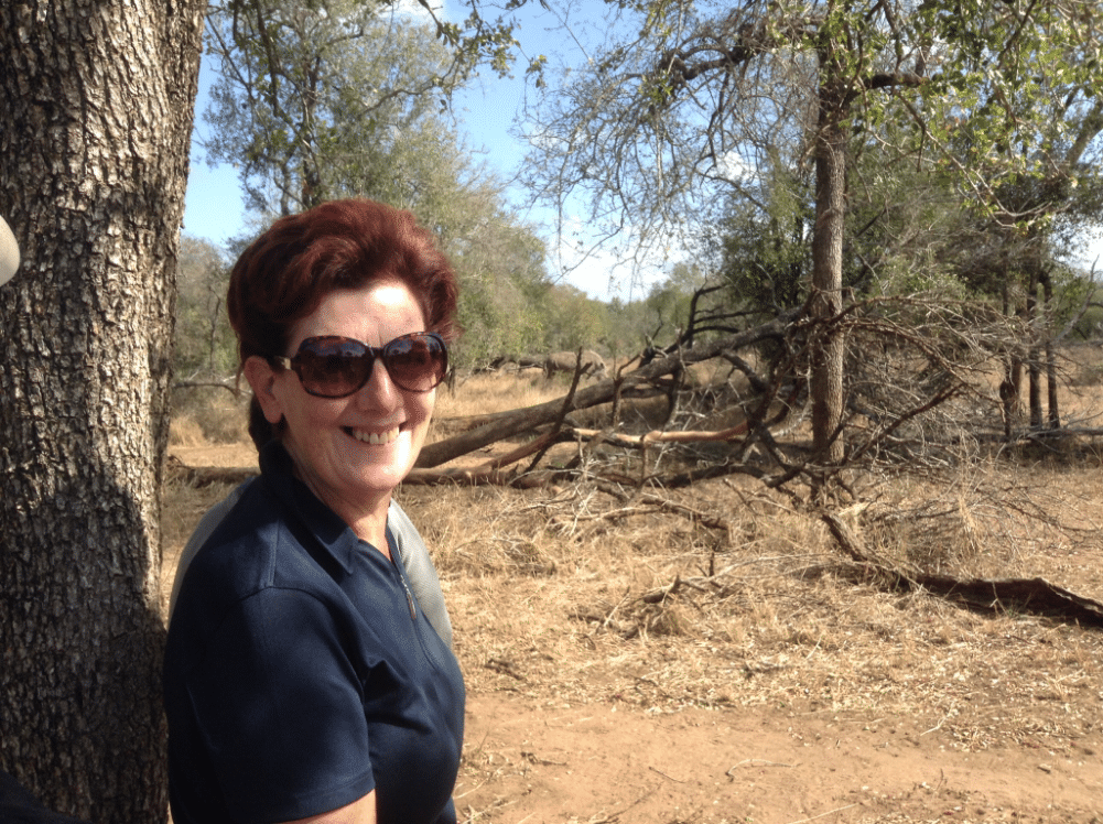 Woman stood by tree in desert - Walking Safaris in Eswatini