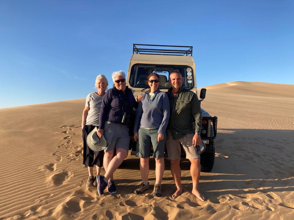 Guests by a jeep on the Living Desert Tour.